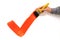 Man painting red checkmark or tick, holding paintbrush, white background