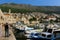 Man paints landscape of boats and houses in Dubrovnik, Croatia