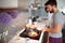 Man in pajamas prepare breakfast for his girl