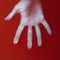 Man palm in red blood water, male hand, cover for art in horror genre, detective novel, concept struggle,creative idea