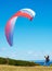 Man, parachute and paragliding launch in nature with safety training, healthy adventure and extreme sport. Person