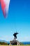 Man, parachute or paragliding sport in launch exercise, healthy adventure or extreme fitness for wellness. Person