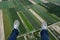Man paragliding above fields