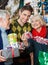 Man With Parents Shopping In Christmas Store