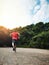 Man in park, back and running for fitness in nature, exercise and training for marathon with athlete and sports. Runner