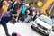 A man participates in the competition for the holiday Maslenitsa and drags a lightweight LADA car on a rope. City of Cheboksary,