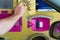 Man paying toll at an automatic toll booth station on a French highway close up view