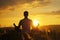 Man Peacefully Meditating In A Serene Yoga Pose During Golden Sunset