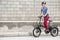 Man pedaling standing on electric bike