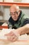 Man Perforating a Plaster Model with Electric Drill