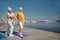 Man performing a warm-up exercise on the quay