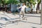 man performs amateur stunts on roller skates in a special roller park in the city