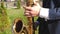A man performs the blues on a saxophone in a city park. man playing saxophone jazz music. Saxophonist in dinner jacket