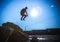 Man performs freerunning jump on stones