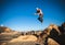 Man performs freerunning jump on stones