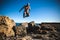 Man performs freerunning jump on stones