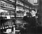 Man in a pharmacy mixing medicine