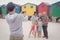 Man photographing family at beach