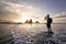 Man during photographing landscape with cliff