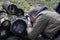 Man photographing nature, leaning on a log