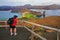 Man photographing panoramic view of Bartolome island in Galapagos