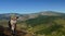 Man photographing panoramic views from the PeÃ±a Tremaya. Palencia. Spain