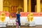 Man photographing temple Wat Sensoukaram in Louangphabang, Laos. Copy space for text.
