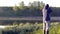 A man photographs the morning fog. Warm summer landscape.