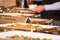 Man picking food from chafing dish heaters