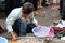 Man picking shrimp to the basket at fresh market in The Central Market, a large market with countless stalls of goods