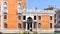 Man on pier near palazzo on Grand Canal in Venice