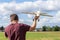 Man piloting a radio remote controlled airplane