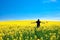 Man with pinwheel standing in a field