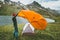 Man pitching tent camping outdoor Travel adventure lifestyle