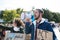 Man with placards and amplifier on global strike for climate change, shouting.