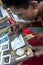 A man places a piece of moonstone into a ring at a factory in Mitiyagoda on the west coast of Sri Lanka.