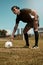 Man, placing and soccer ball with hand on field for kick, penalty or goal in game, training or match. Sport, football