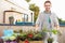 Man Planting Container On Rooftop Garden