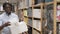 Man with plastic laundry box at hardware store