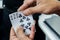 Man play poker card in hands for gambling