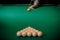 Man is player preparing and aiming to smash white balls in Russian billiards on green table