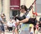 Man playing bagpipes in a parade in small town America