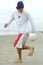 Man playing beach soccer