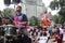 A man playing the big drum during the festival of Ganesha.