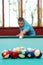 Man playing billiards focus on balls