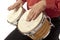 Man playing bongo set on his lap