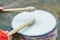 Man playing the djembe african drum outdoors wood