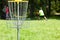 Man playing flying disc golf sport game in the city park