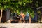 Man playing with frisbee on tropical beach in Koh Phangan, Thailand.