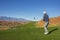 Man playing golf on a beautiful scenic desert golf course